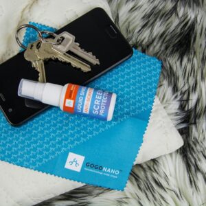 Phone, keys, screen protector, and cleaning cloth.
